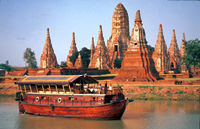 Cruise between Bangkok and the ancient capital of Ayuthaya, staying overnight alongside a traditional Buddhist temple.